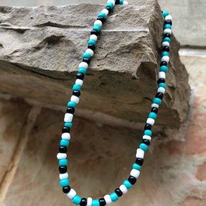 A teal, black, and white chocker that fits great!!